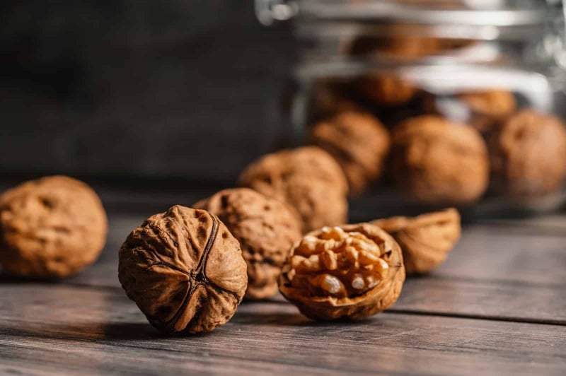 Close-up of walnuts on wood, healthy snack, nature food ingredients.