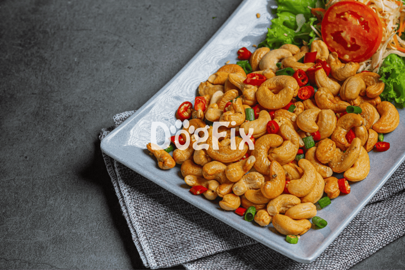 Delicious roasted cashews topped with chili peppers and herbs, served on a stylish plate for a healthy snack or appetizer.
