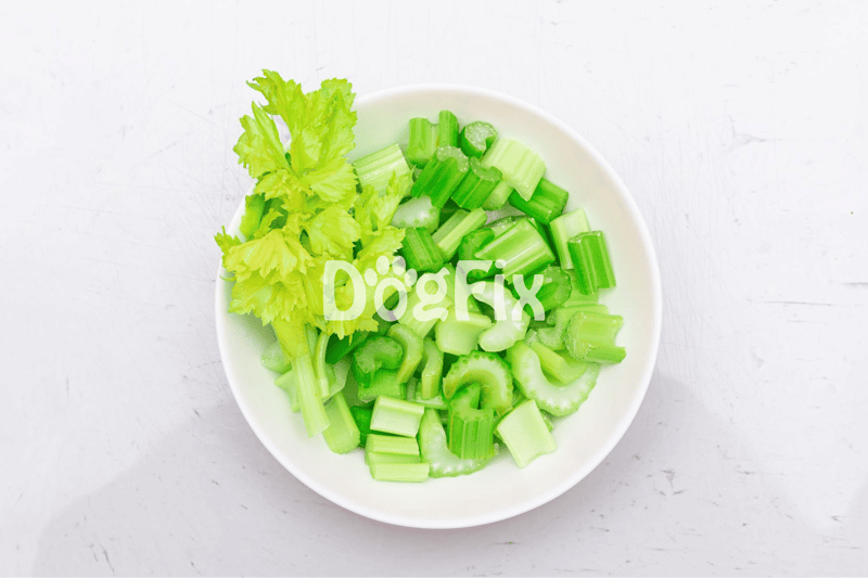 Fresh chopped celery in a bowl, ideal for healthy dog treats and canine nutrition.