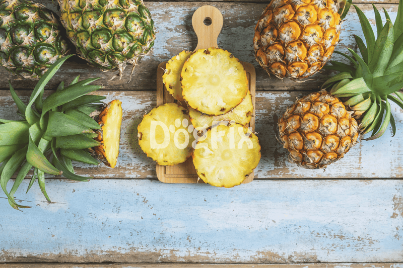 Fresh pineapples on wooden background suitable for nutritious dog treats.