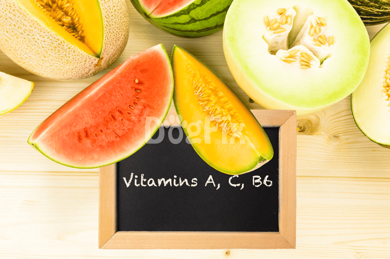 Juicy and ripe watermelon slices on a wooden table, highlighting vitamin-rich healthy foods for dogs.