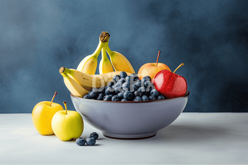 Healthy and colorful fruit platter featuring bananas, apples, and blueberries for a nutritious snack.