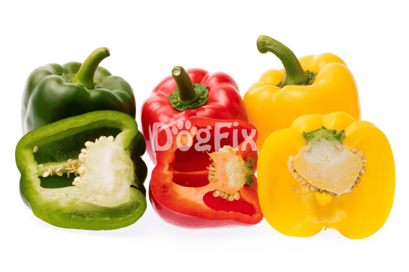Bright green, red, and yellow bell peppers sliced open on white background.
