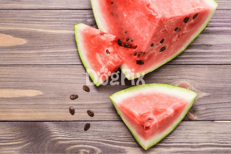 Fresh watermelon slices on rustic wooden table, juicy and sweet summer fruit with black seeds.