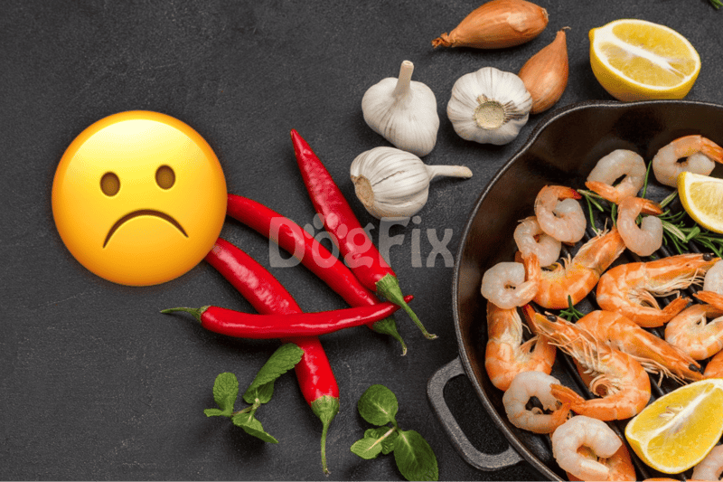 Alt text: Shrimp with garlic, lemon, chili peppers, and herbs on black surface.