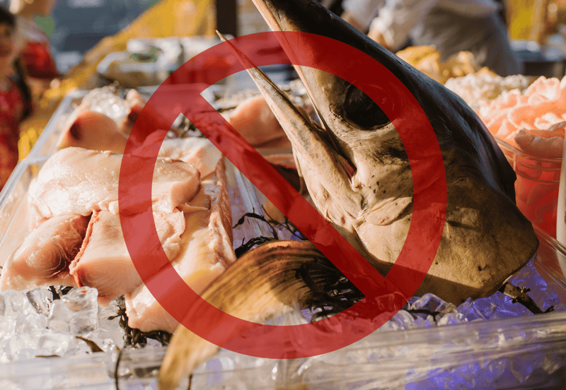 Fresh tuna fish at market, not suitable for pet consumption, check pet-safe food options.