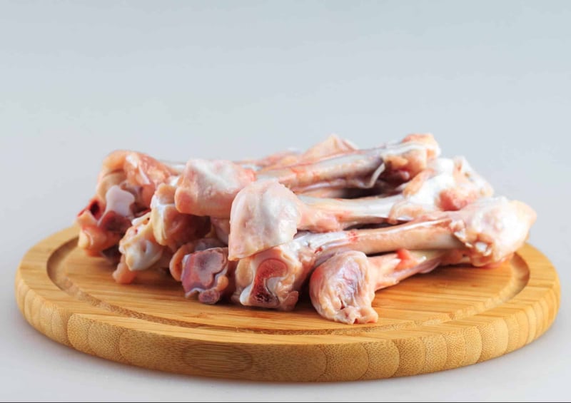 Fresh raw chicken bones for dogs, a natural and healthy treat option.