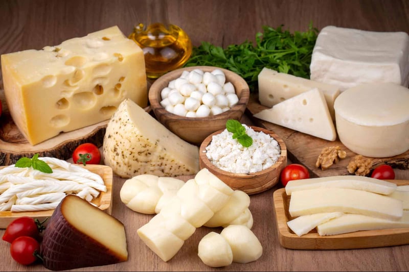 Delicious cheese selection including various cheeses, herbs, and dairy products for dog treats and healthy snacks.