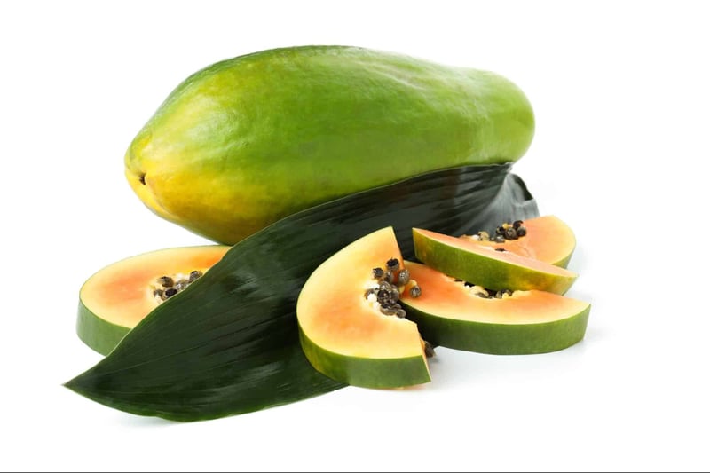 Fresh papaya slices with black seeds, healthy snack option for dogs.