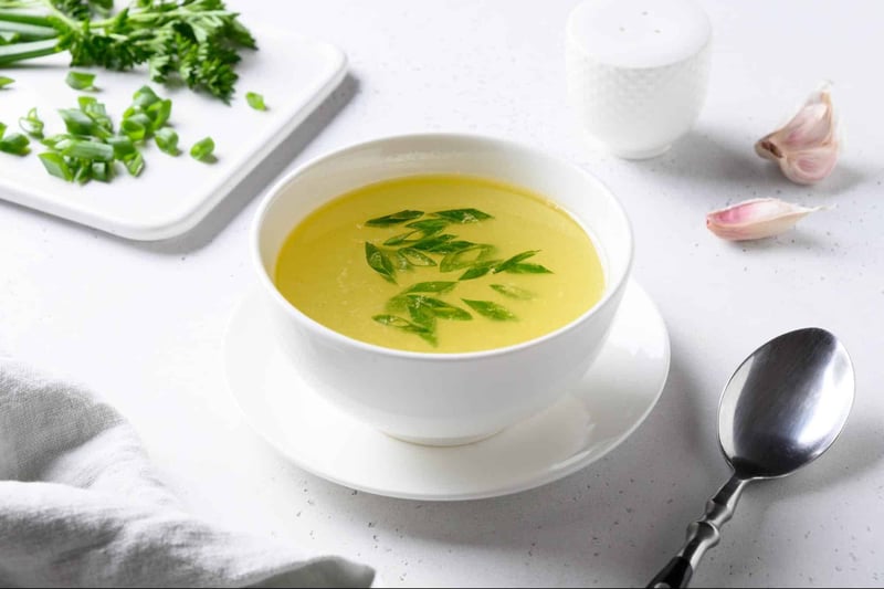 Delicious homemade vegetable broth with fresh herbs and garlic. Perfect for nutritious, healthy meals.