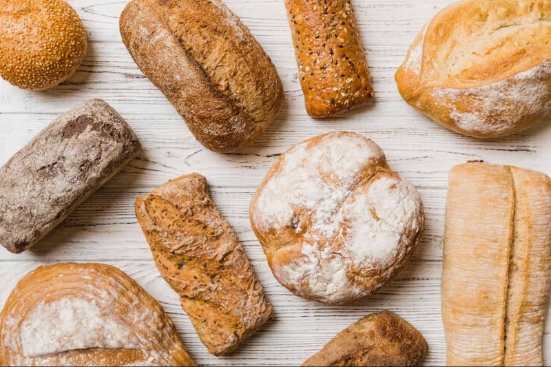 Artisan bread collection showcasing various types of fresh baked bread from a bakery.