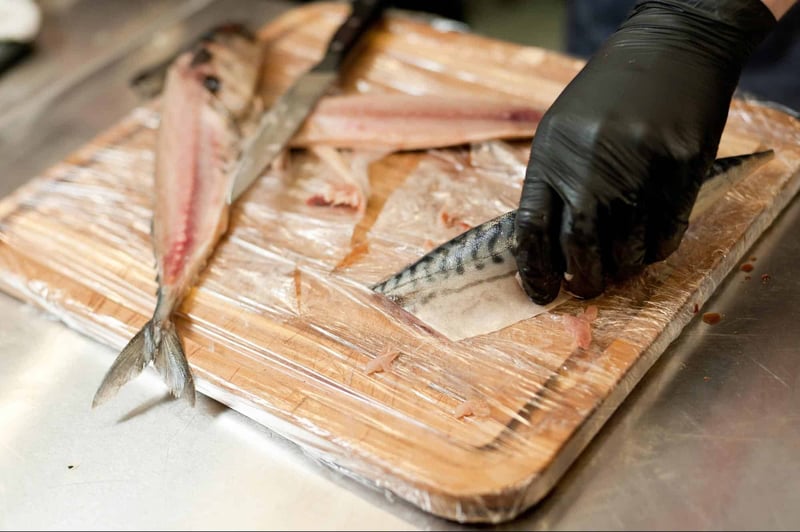 High-quality fish for healthy dog nutrition on a wooden cutting board.