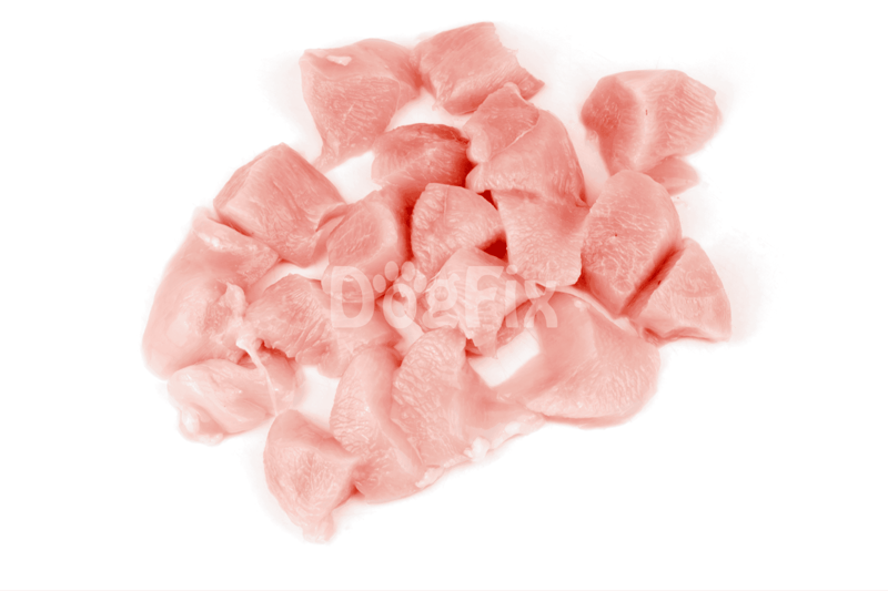 Raw chicken meat pieces for dog nutrition and wellness.