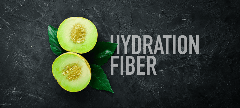 Fresh green melon on dark textured background, promoting hydration and fiber benefits.
