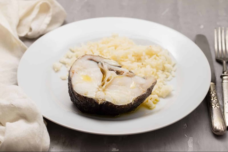 Healthy fish and potato meal for dogs, natural pet nutrition, fresh homemade dog food.