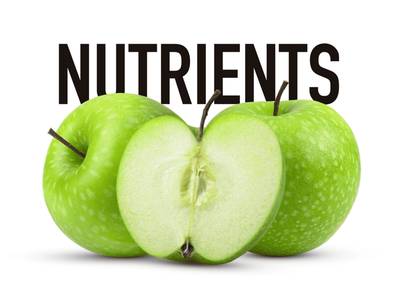 Bright green apple with a sliced half showing juicy interior, highlighting healthy nutrients for dogs.
