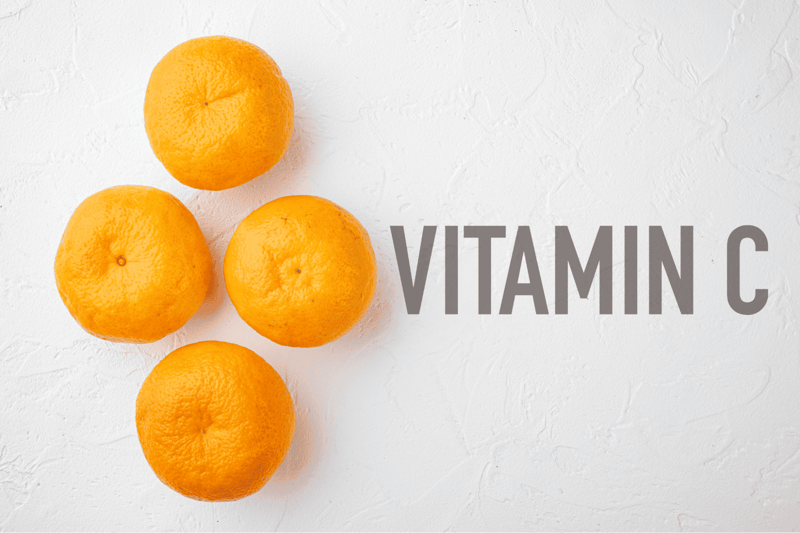 Bright oranges on white background with "Vitamin C" text.