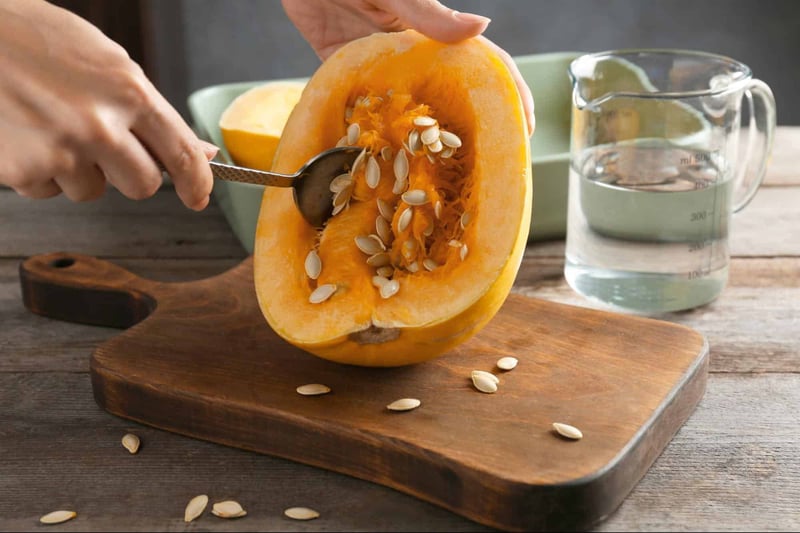 Fresh pumpkin being prepared for dogs, seed removal, healthy treat or meal ingredient.