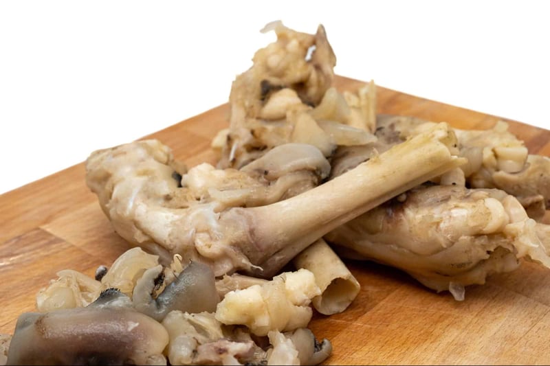 Dog bone with meaty bits, ideal for dog treats and chew toys. Safe, tasty dog snack for healthy pet digestion.