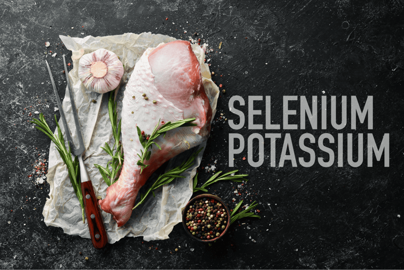 Fresh pork, garlic, black pepper, and rosemary on a dark surface, promoting healthy dog nutrition.