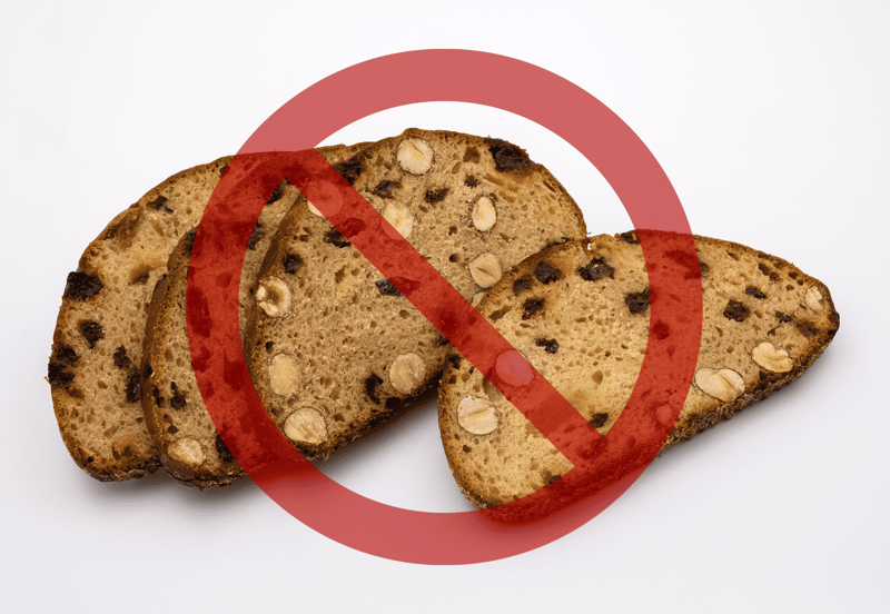 Alt text: Image showing dog treats with a red prohibition sign.