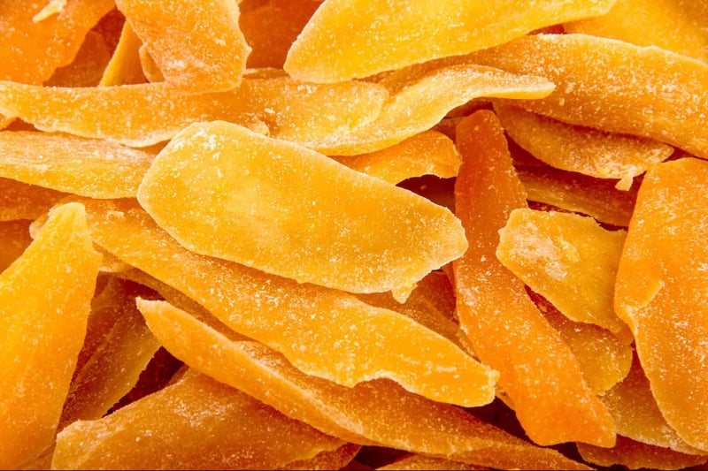 Fresh dried mango slices for dogs, healthy and tasty dog treats, natural snacks for pets.