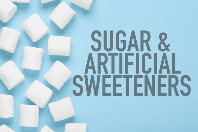 High-quality image of sugar cubes and artificial sweeteners on a blue background for healthy living tips.