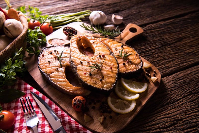 Delicious grilled salmon served with lemon slices and herbs, ideal for pet-friendly meals. Perfect for healthy canine treats.