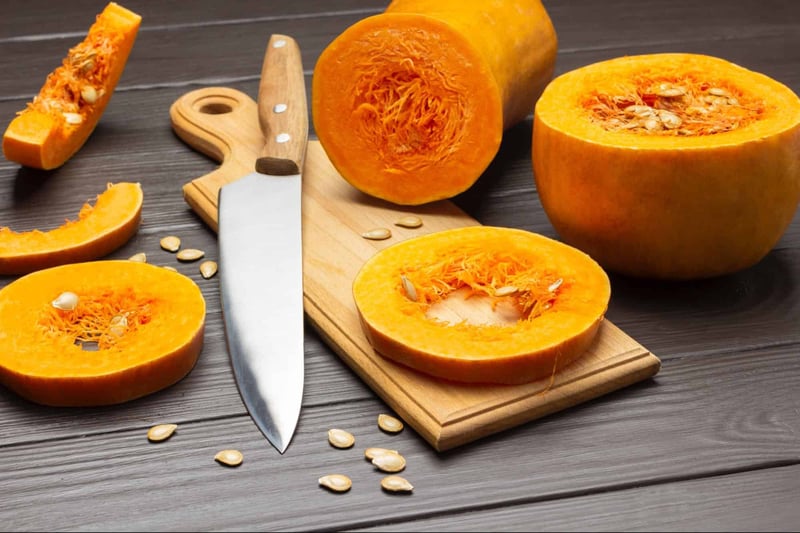 Healthy dog treat pumpkin cut in pieces.