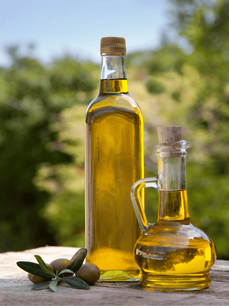 High-quality olive oil bottles with cork and glass design, perfect for healthy dog nutrition and supplements.