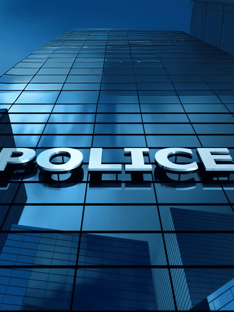 Modern police station building with glass facade, law enforcement headquarters, law enforcement facility.