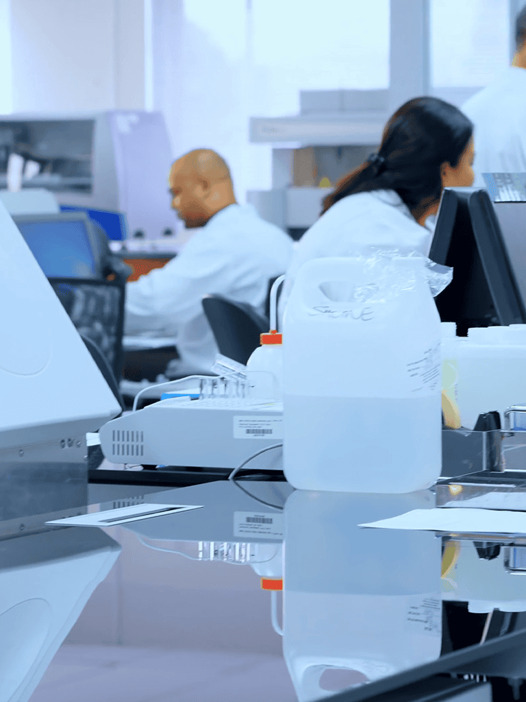 Laboratory scientists working in biotech lab during research.