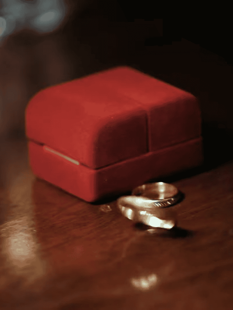 Elegant ring inside a red velvet ring box.