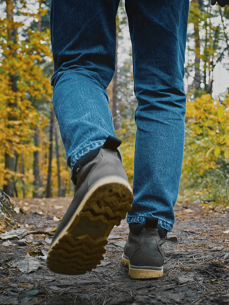 Durable hiking boots for outdoor adventures. Perfect for trail walking in autumn forest settings.