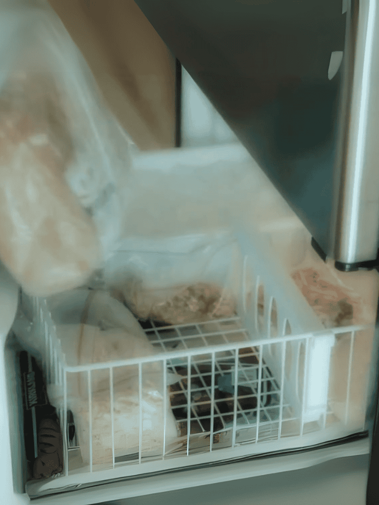Dog food stored in a protective, secure container with a wire basket for easy access and freshness preservation.