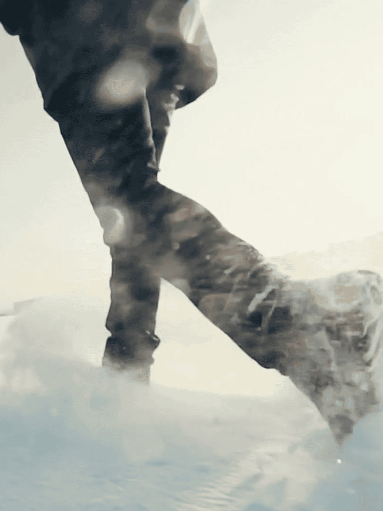 Dog playing in snow with outdoor gear, winter adventure, pet outdoor activity.