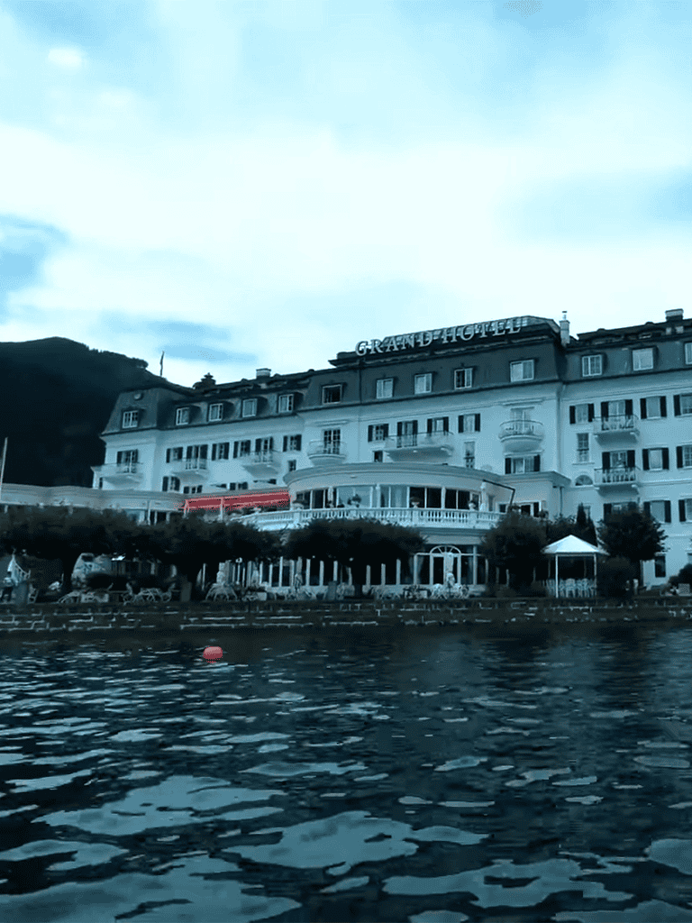 Luxury lakeside hotel with waterfront views and elegant accommodations.