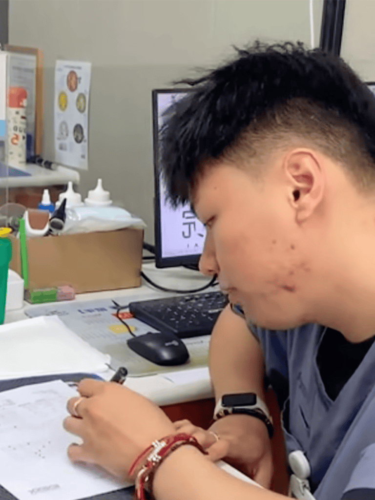 Veterinary professional reviewing patient records.