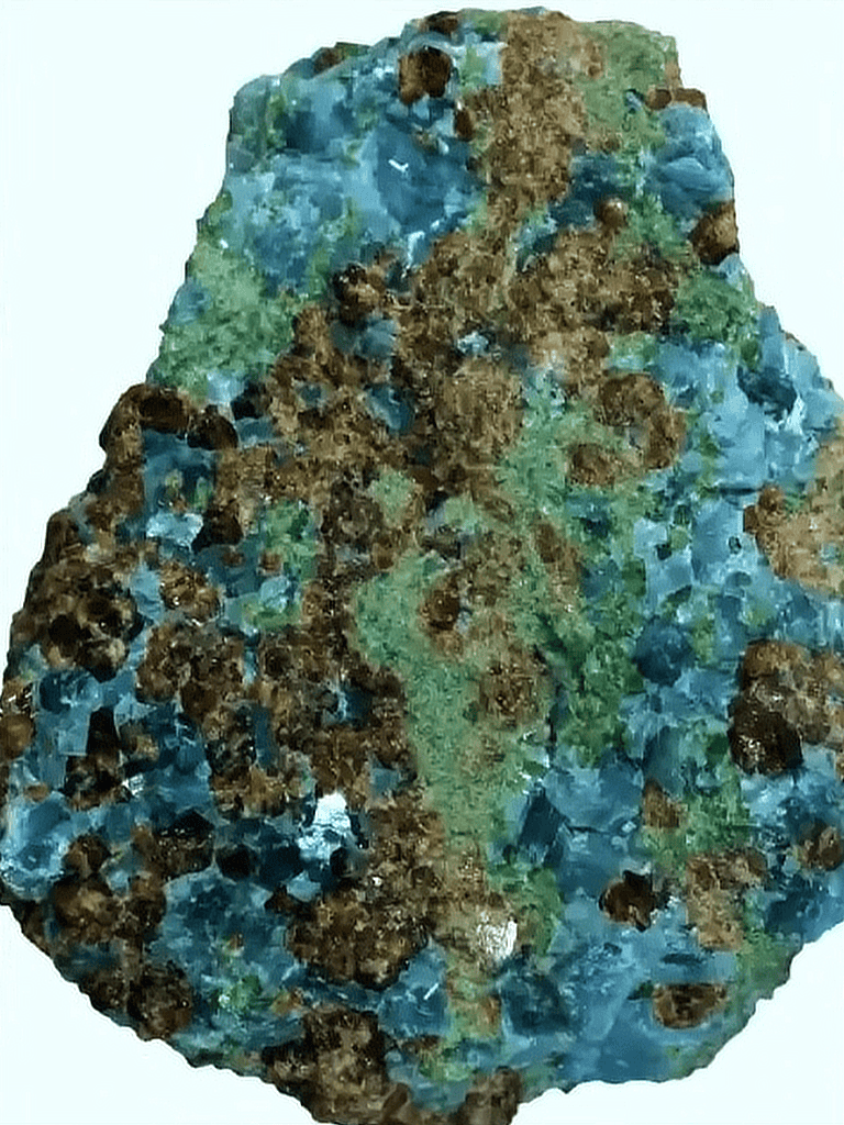 Vivid blue, green, and brown mineral crystal rock close-up.