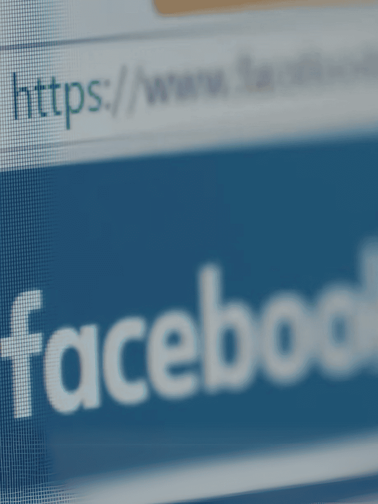 Facebook logo on screen.