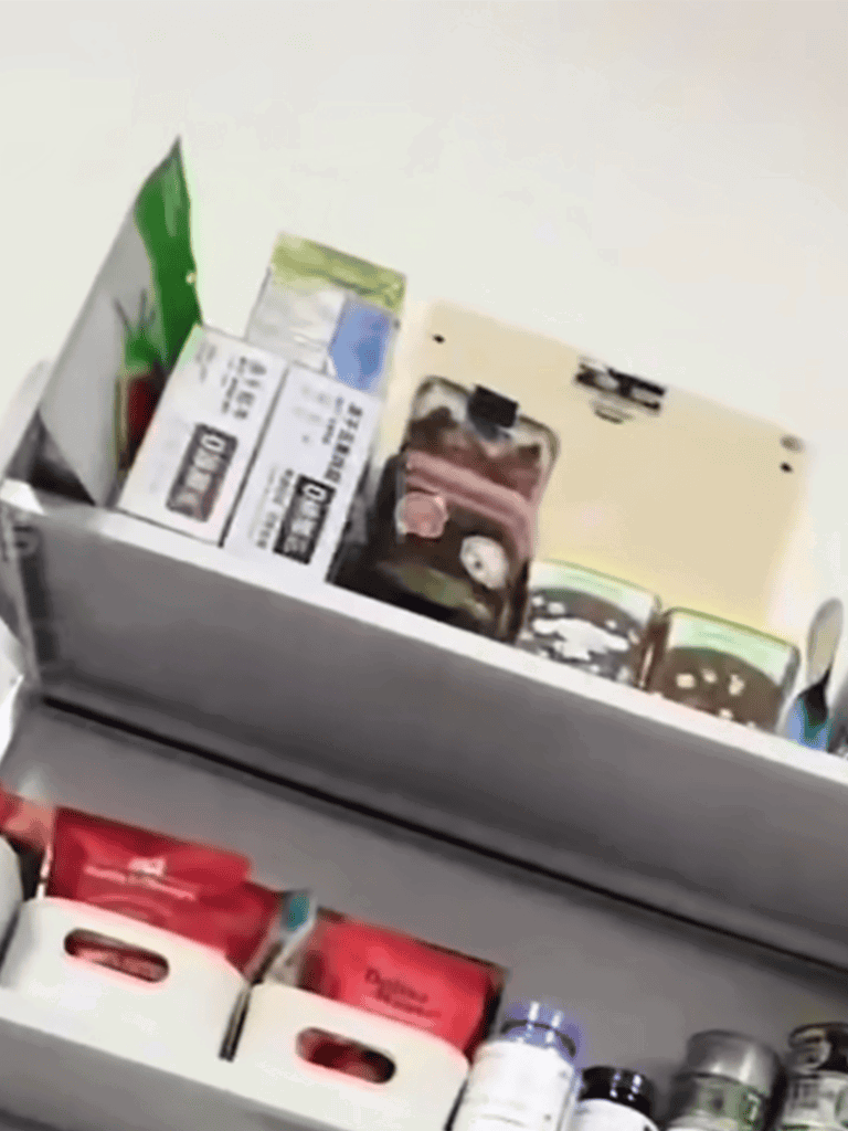 Dog food and supplement containers on pantry shelf.